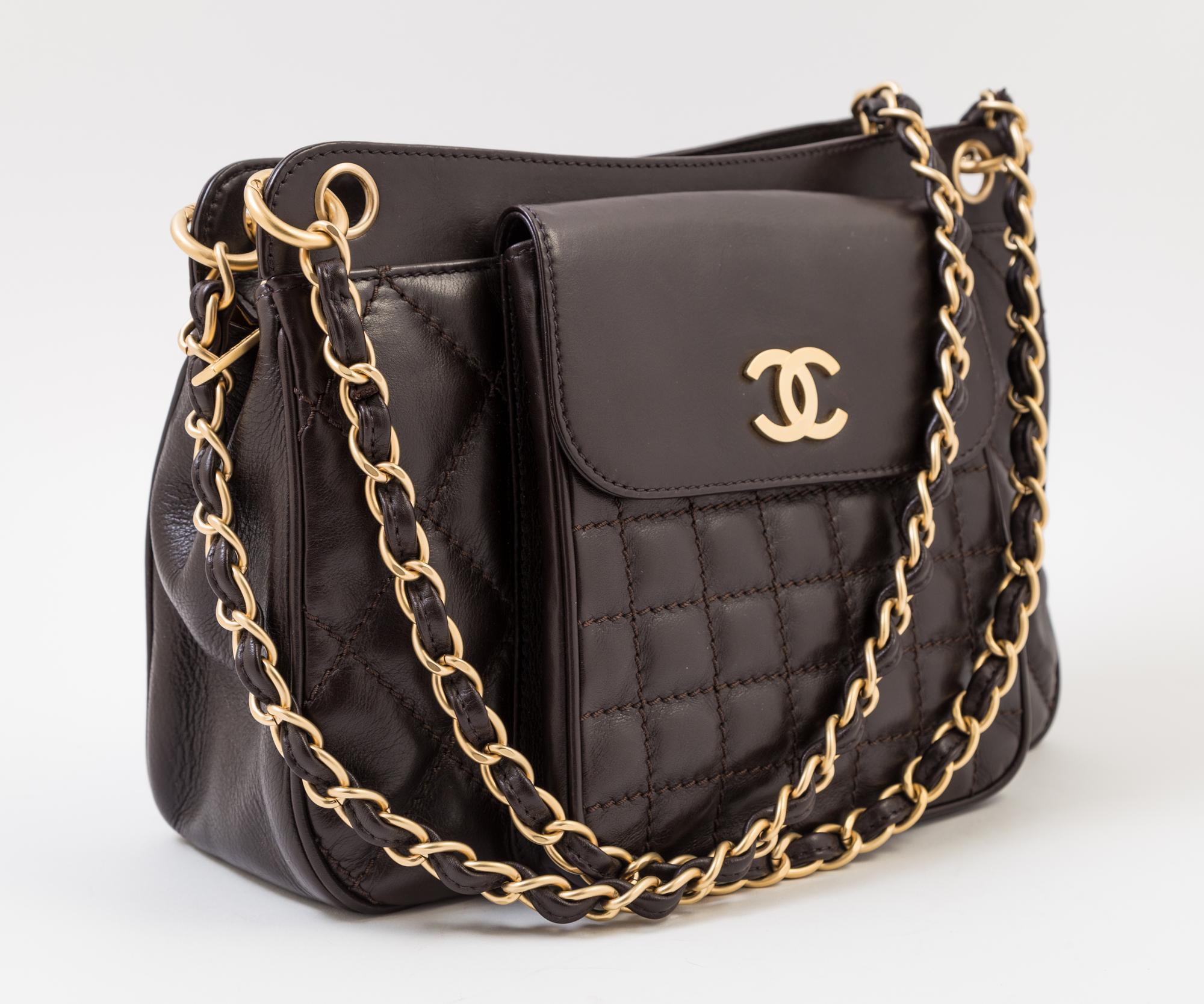 A Chanel Brown Leather Quilted Handbag, 12" x 8" x 3.5"; Strap drop: 10".
