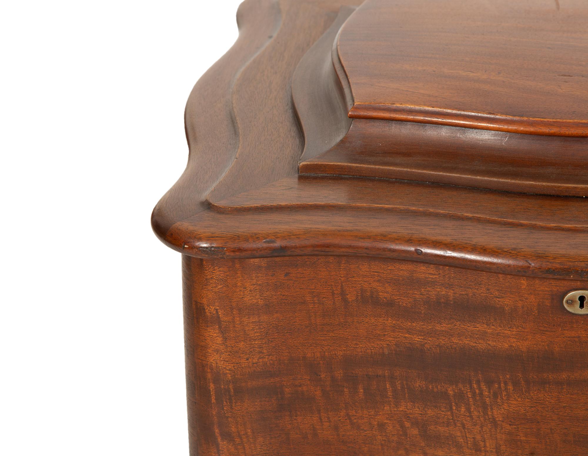 A Regina Mahogany Serpentine Cabinet Music Box