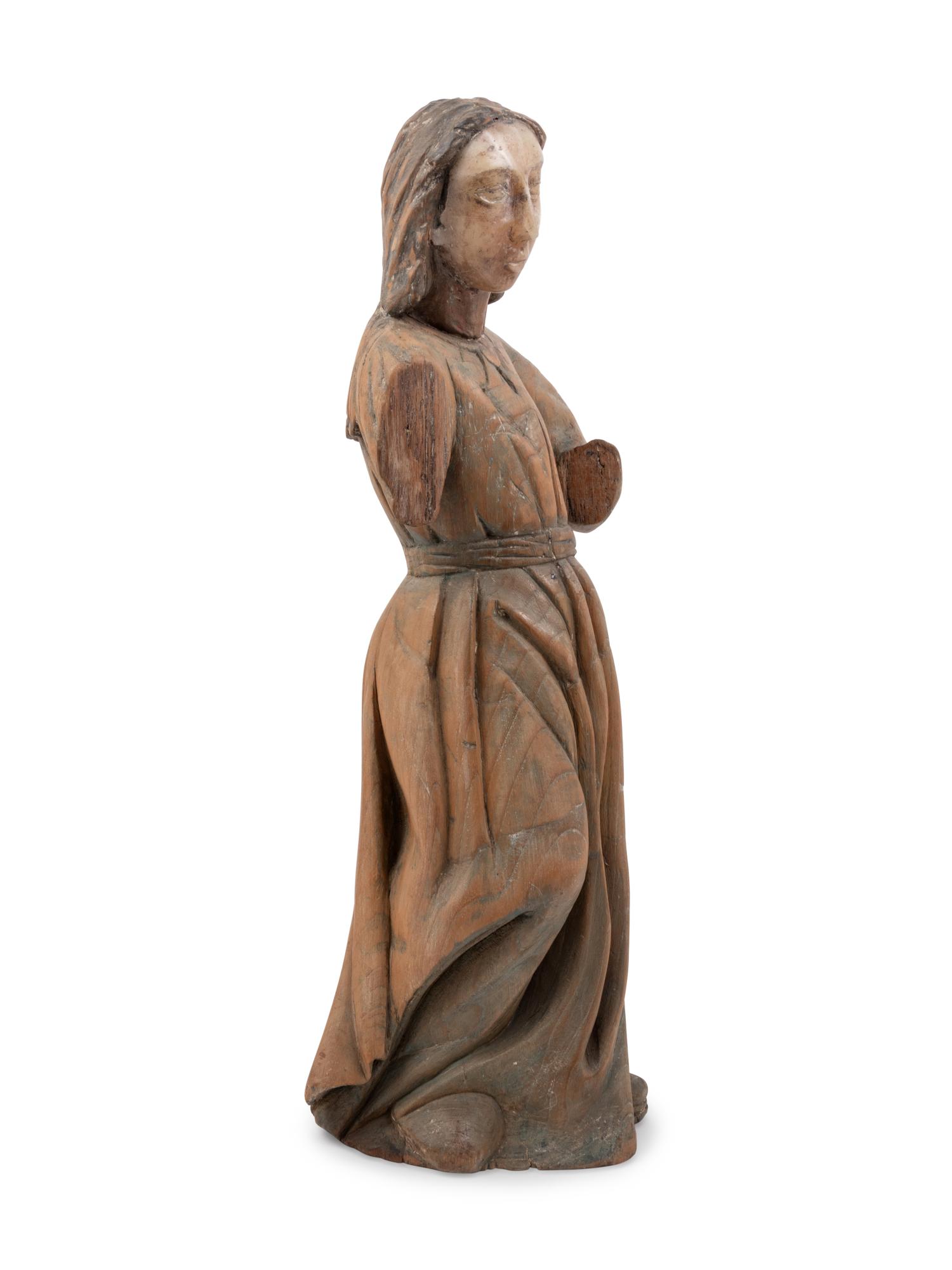 A Mexican Colonial Carved Wood and Alabaster Figure of a Saint