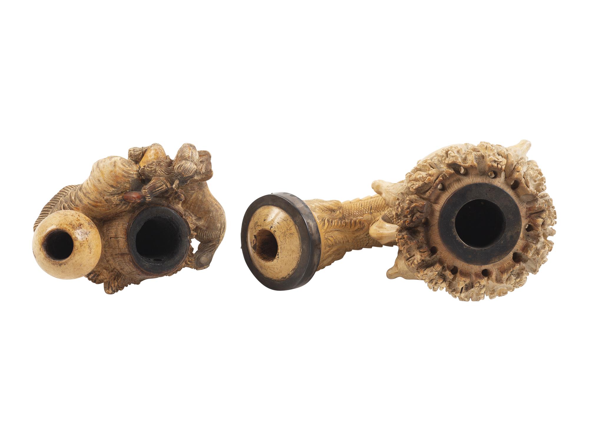 [AMERICANA - PIPES]. 2 ornately carved meerschaum pipes, each featuring animal motifs.