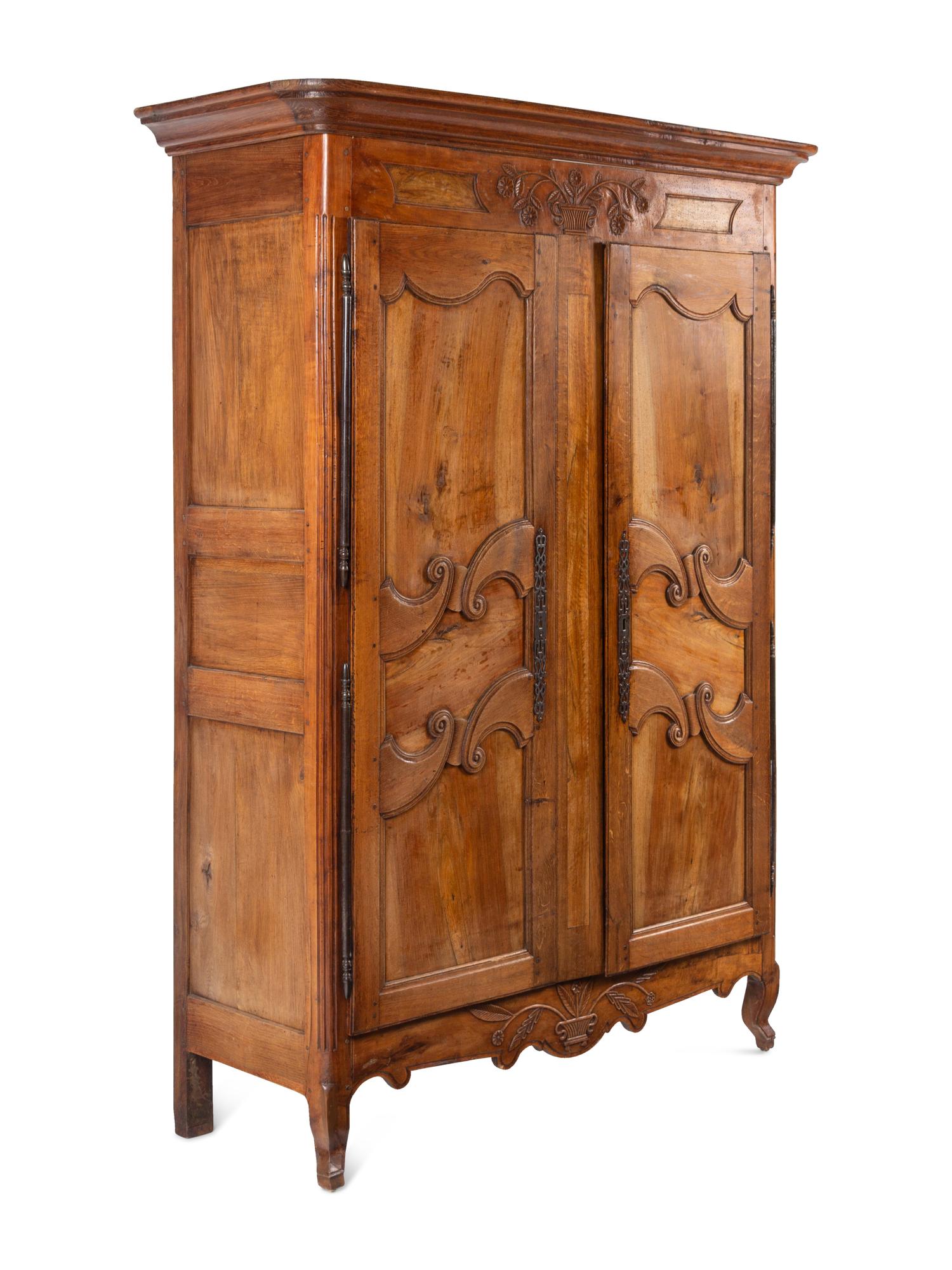 A French Provincial Walnut and Fruitwood Armoire