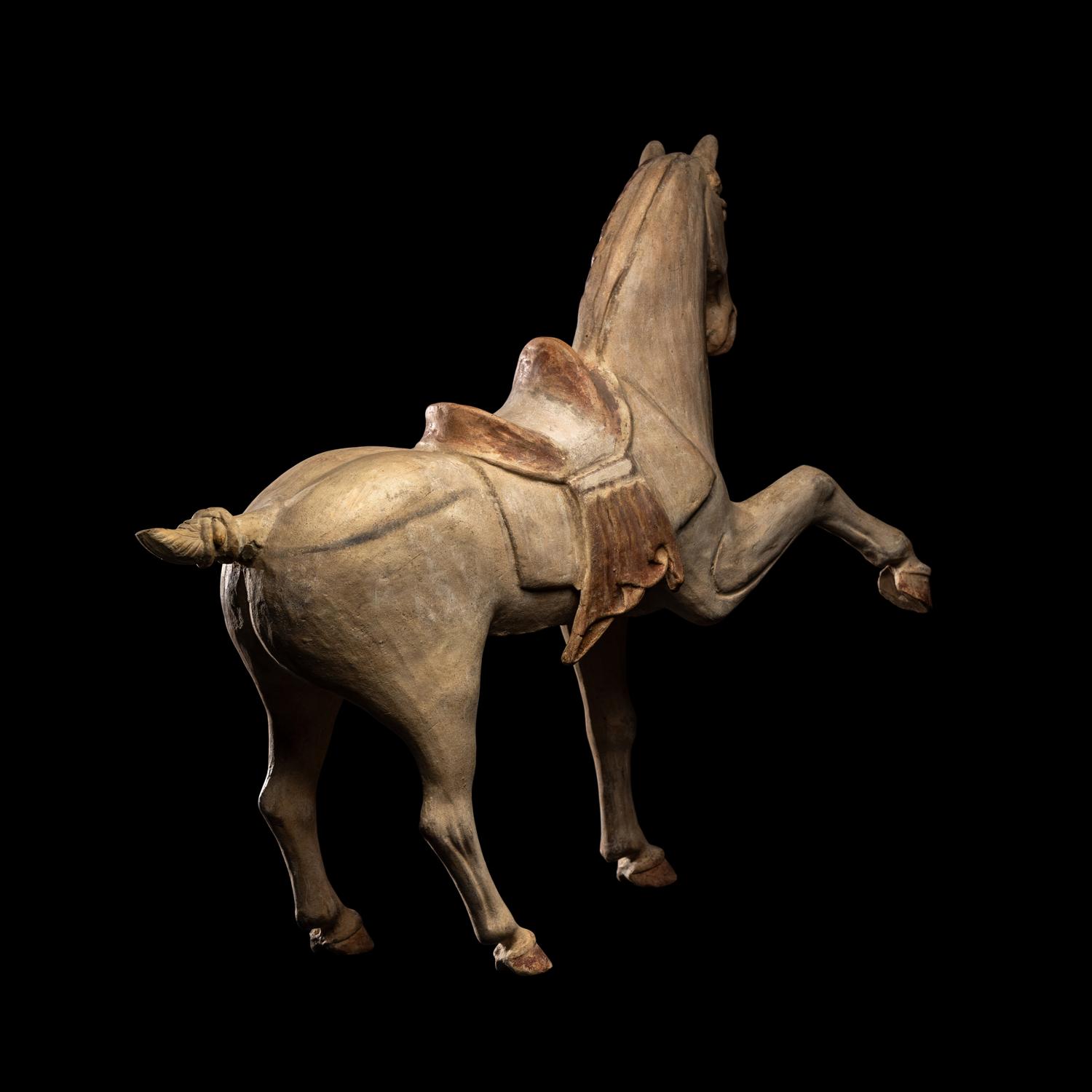 A Chinese Painted Pottery Figure of a Horse