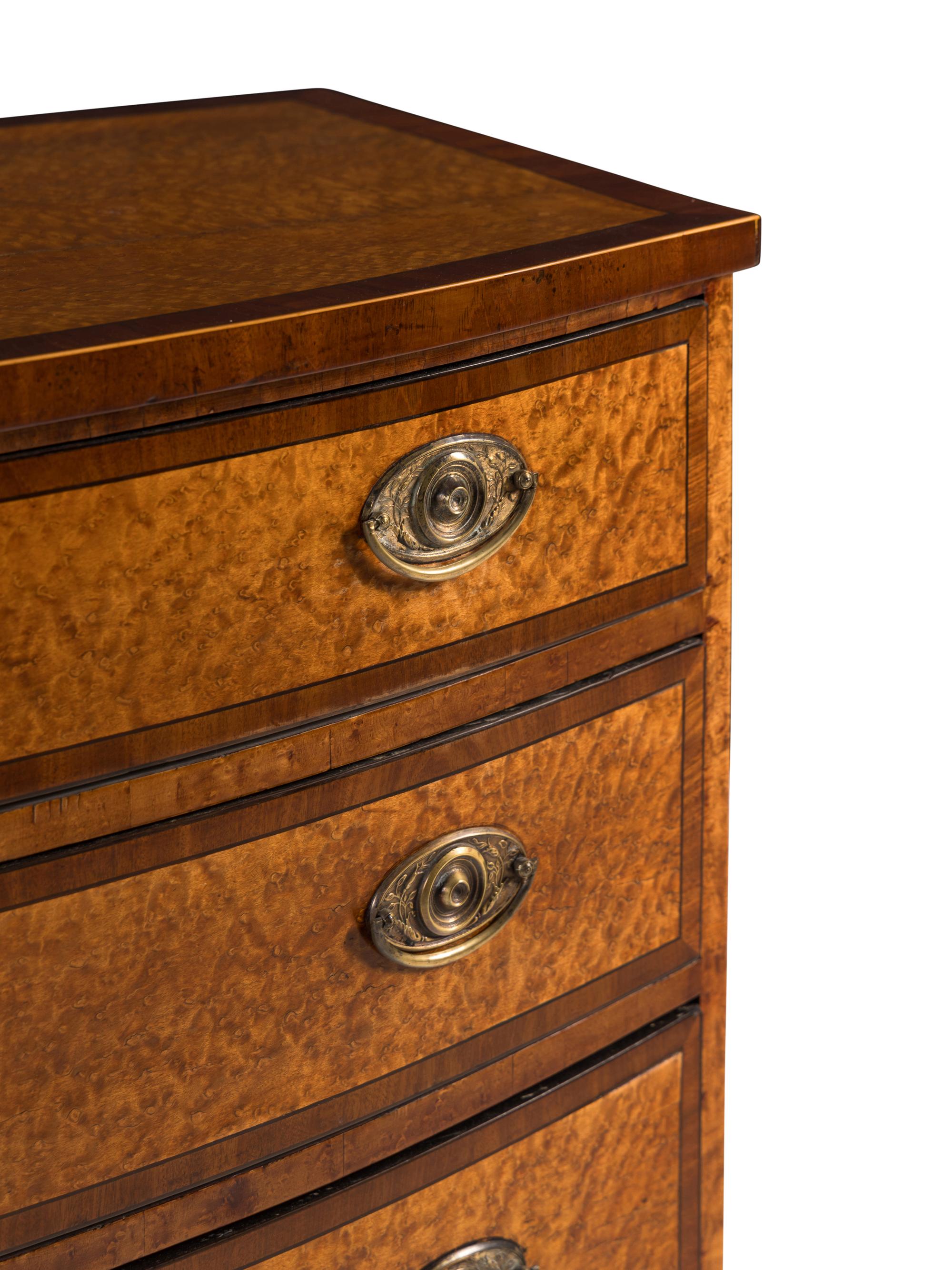 A George III Maple, Satinwood and Mahogany Bowfront Chest of Drawers