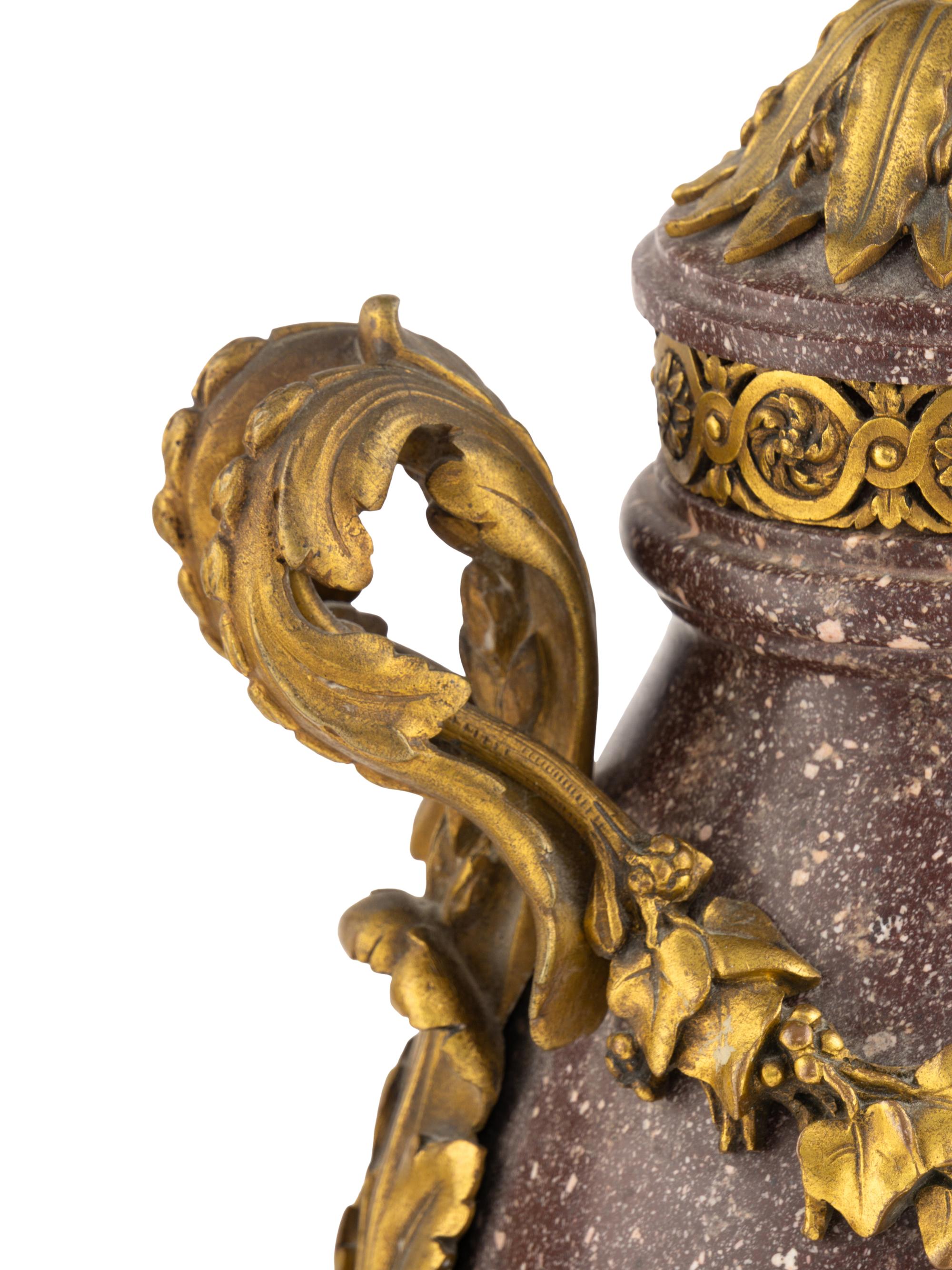 A Pair of Louis XV Style Gilt Bronze Mounted Porphyry Urns