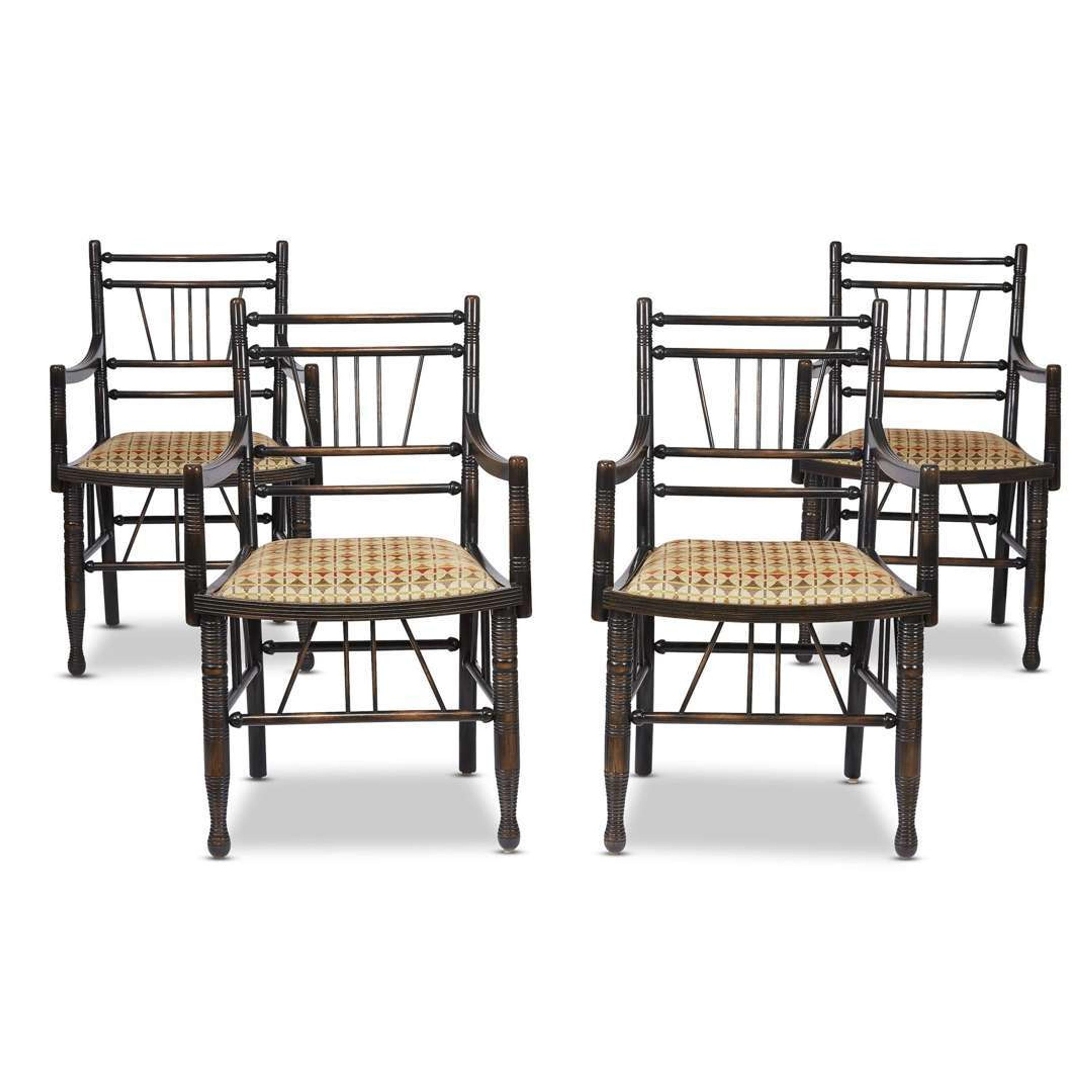A set of four Arts & Crafts style ebonized 'Thebes' armchairs 20th century