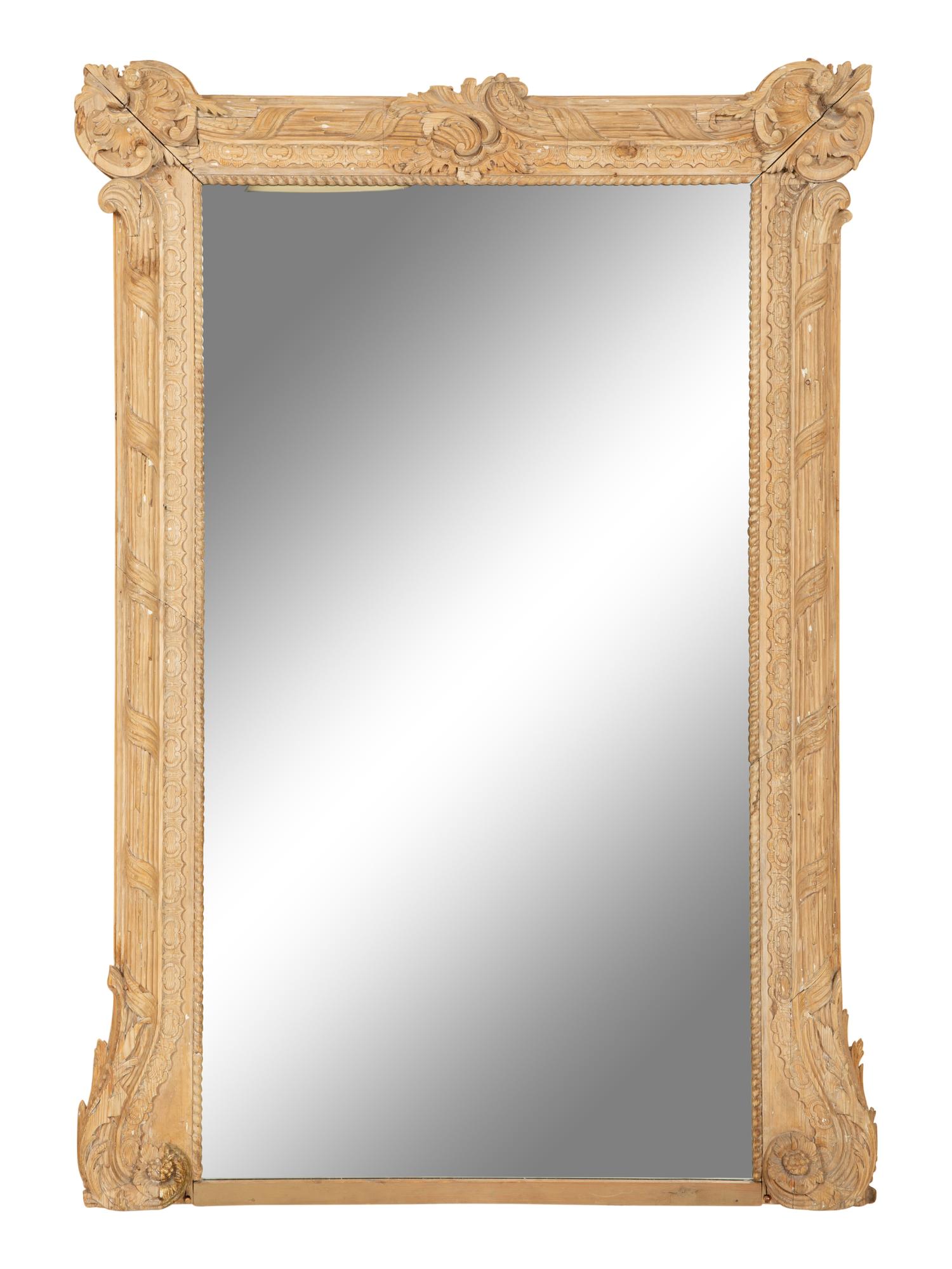 A Large Louis XVI Style Carved Stripped Pine Mirror