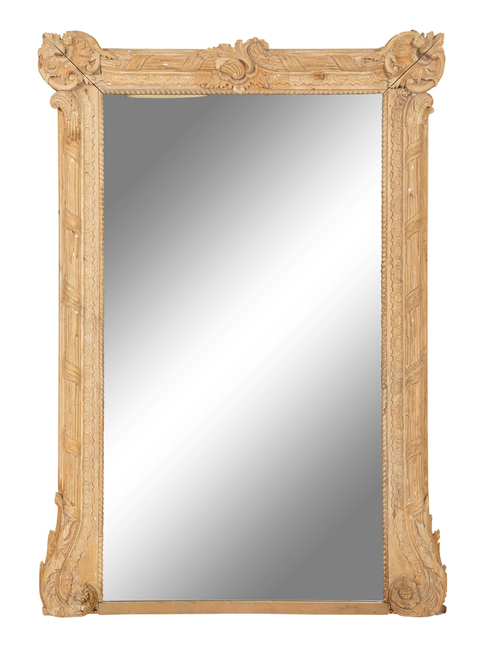 A Large Louis XVI Style Carved Stripped Pine Mirror