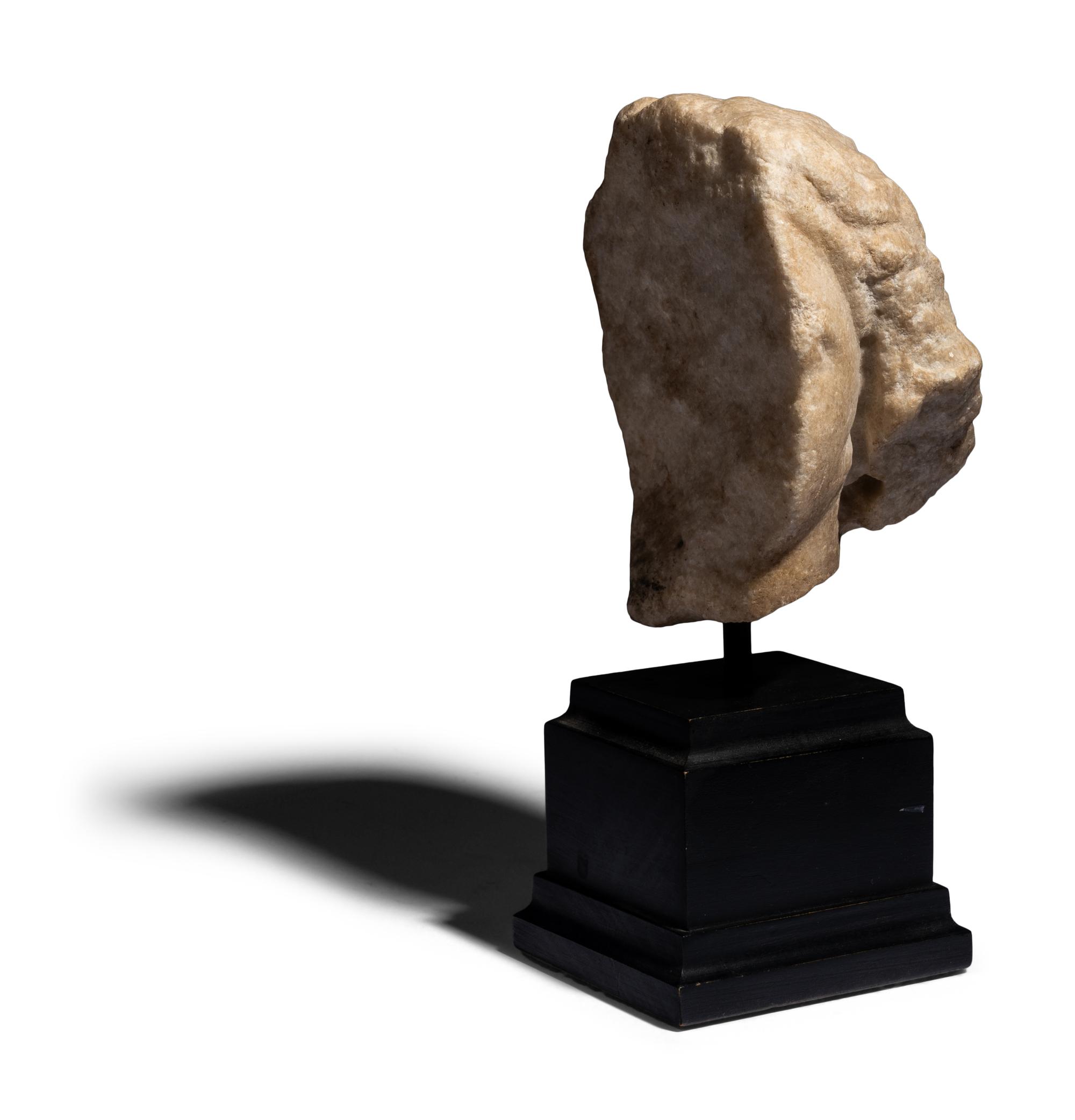 A Roman Marble Fragmentary Head of a Female