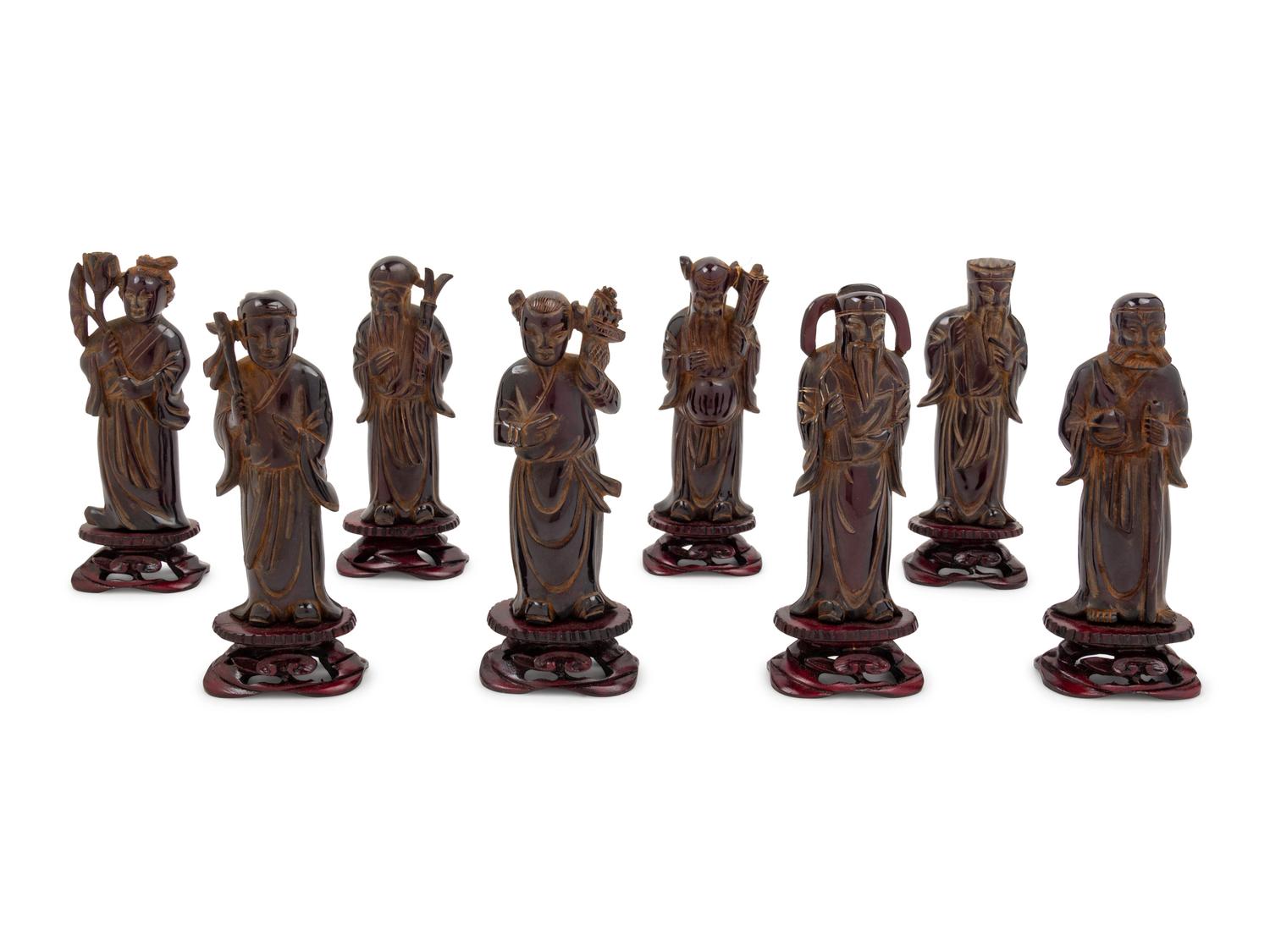 Eight Chinese Black Hardstone Figures of Immortals