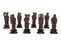 Eight Chinese Black Hardstone Figures of Immortals