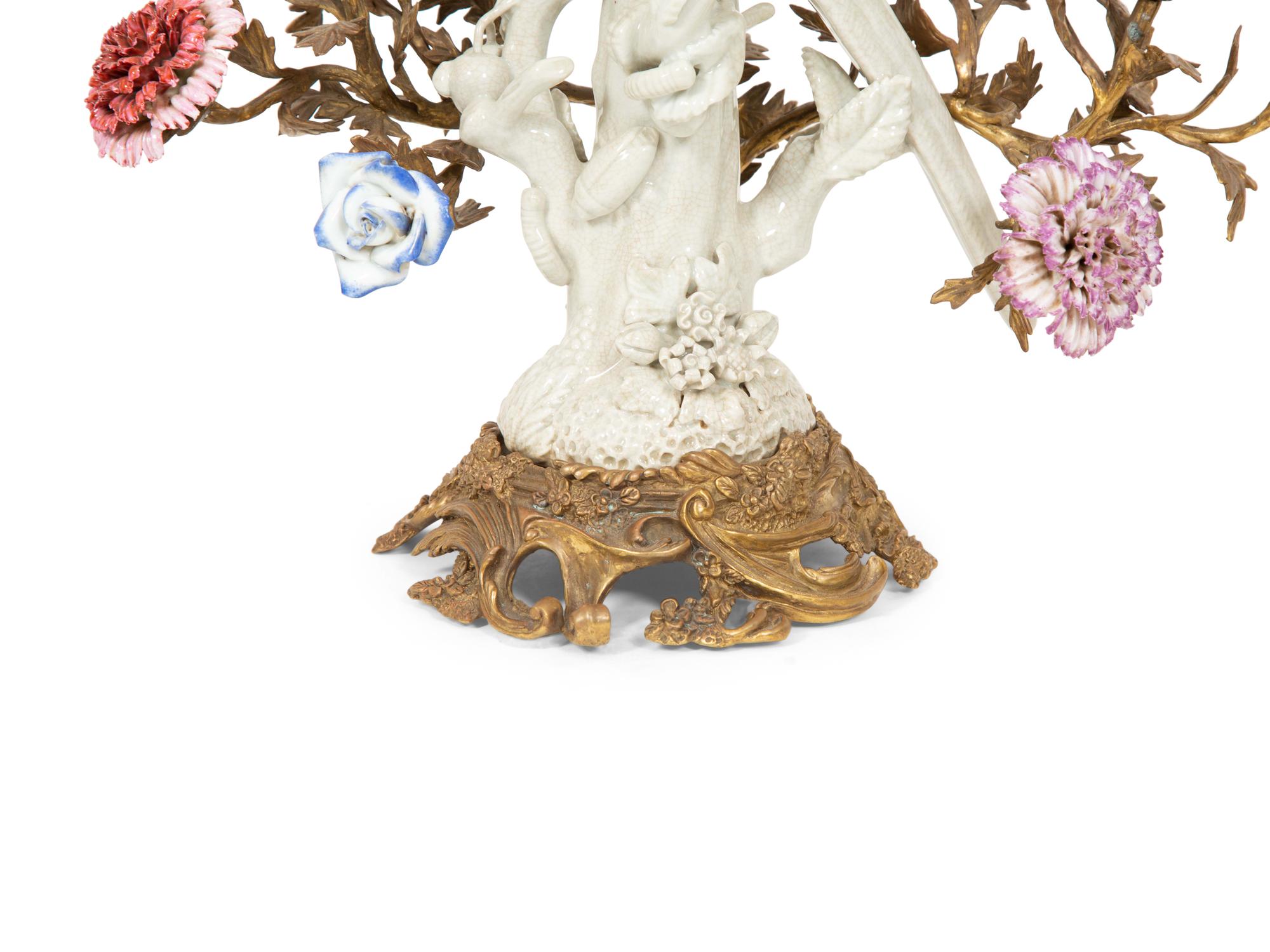 A Pair of Gilt Bronze and Porcelain Three-Light Candelabra
