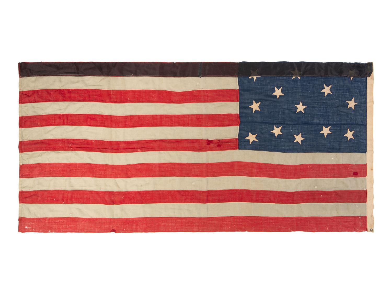[FLAGS]. 13-star American Centennial flag with unusual star pattern. Ca late 19th century.