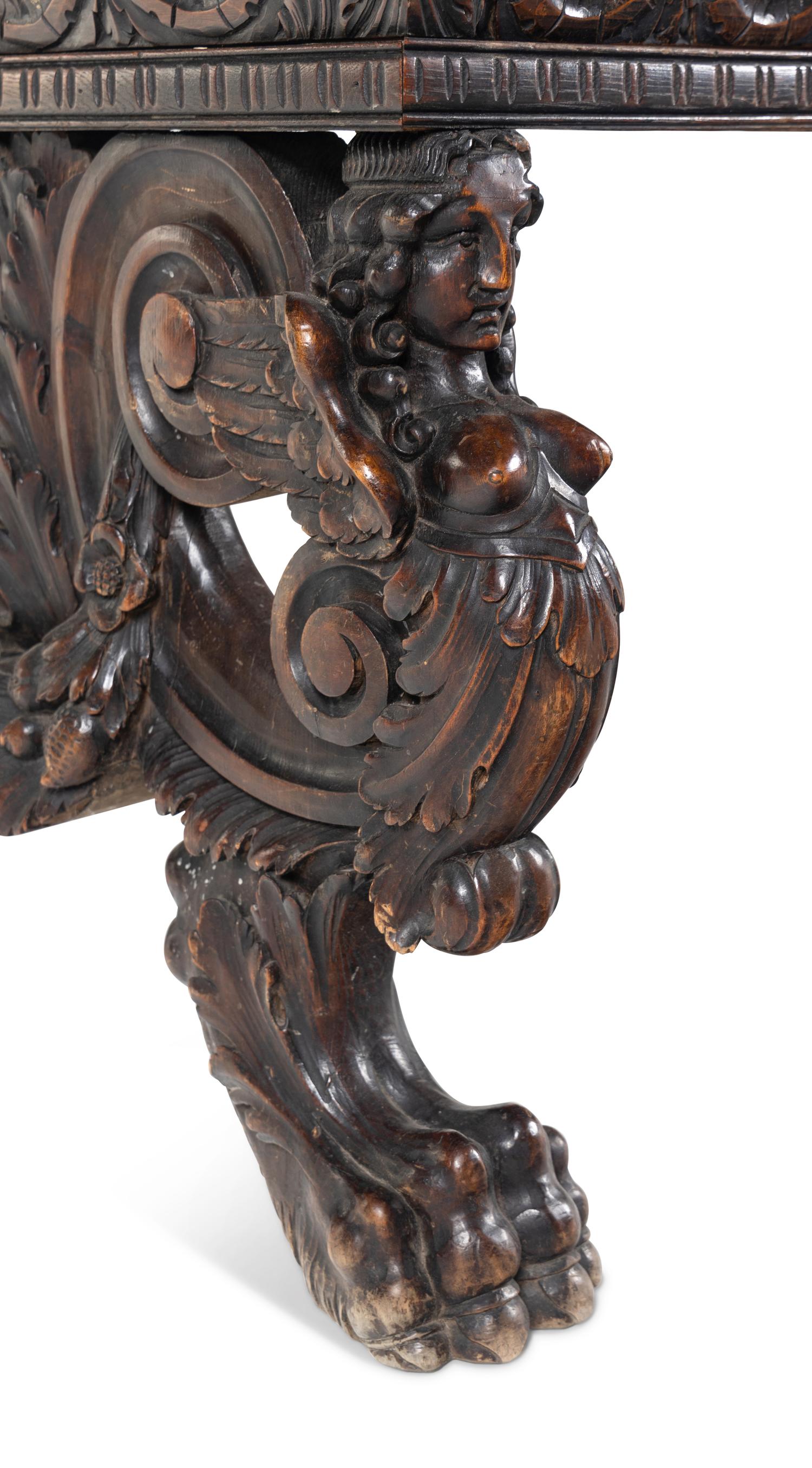 A Renaissance Revival Carved Walnut Trestle Table