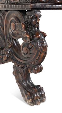 A Renaissance Revival Carved Walnut Trestle Table