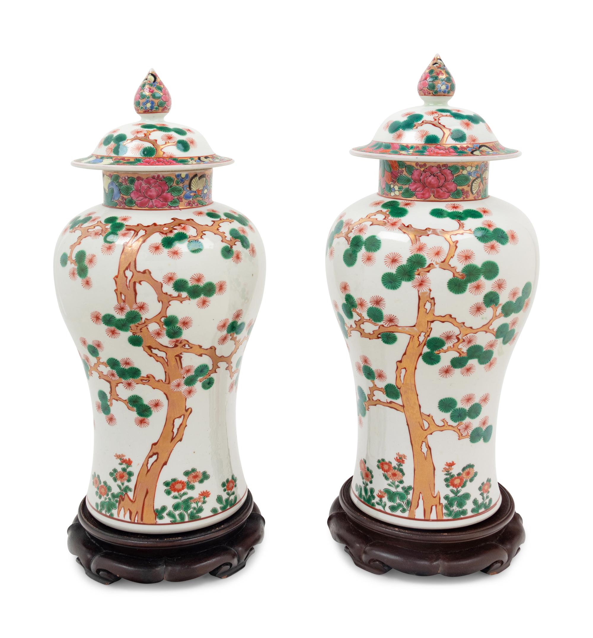 A Pair of Chinese Export Famille Rose Porcelain Covered Jars on Associated Stands