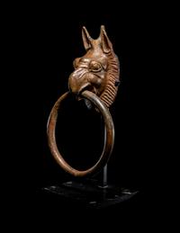 A Greek Bronze Handle with a Griffin Head