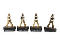 A Group of Four Brass Skeleton Clocks
