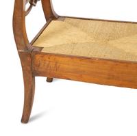 A Northern European Carved Walnut Bench with Rush Seat