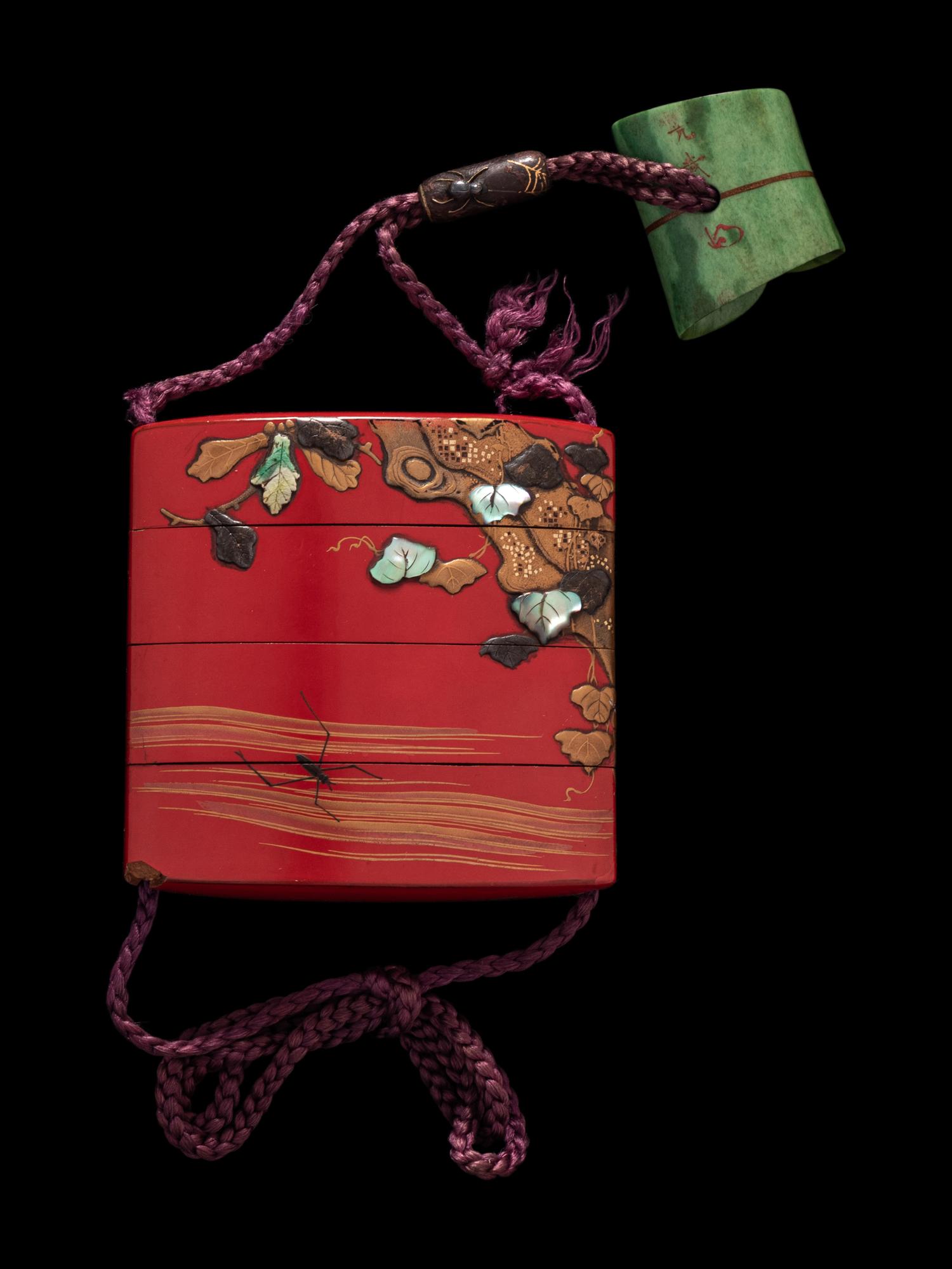 A Japanese Inlaid Gold and Red Lacquer Three-Case Inro