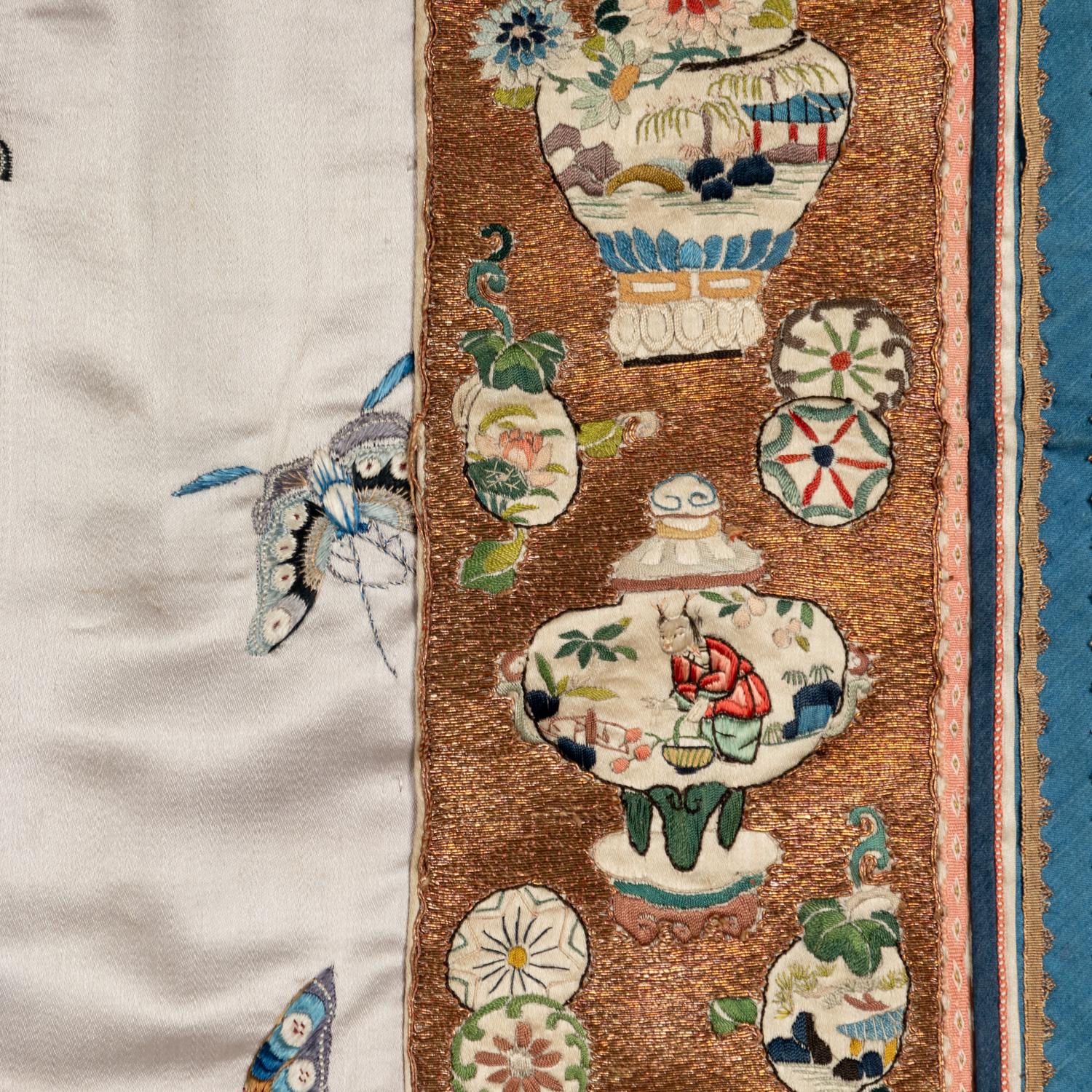 A Chinese Pale Blue Ground Embroidered Silk 'Butterfly' Lady's Informal Robe, Late Qing/Republic Period 晚清/民國 月白緞地百蝶紋女襖