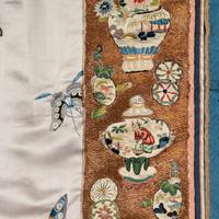 A Chinese Pale Blue Ground Embroidered Silk 'Butterfly' Lady's Informal Robe, Late Qing/Republic Period 晚清/民國 月白緞地百蝶紋女襖