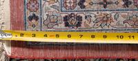 A Qom Wool and Silk Rug