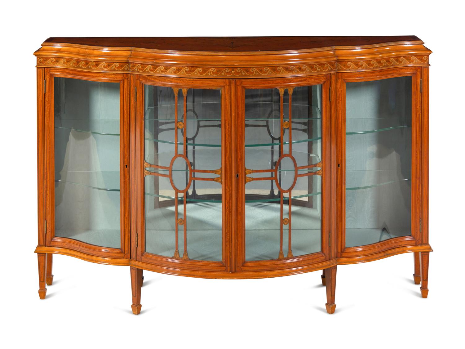 An Edwardian Satinwood and Marquetry Serpentine-Front Cabinet