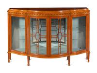 An Edwardian Satinwood and Marquetry Serpentine-Front Cabinet