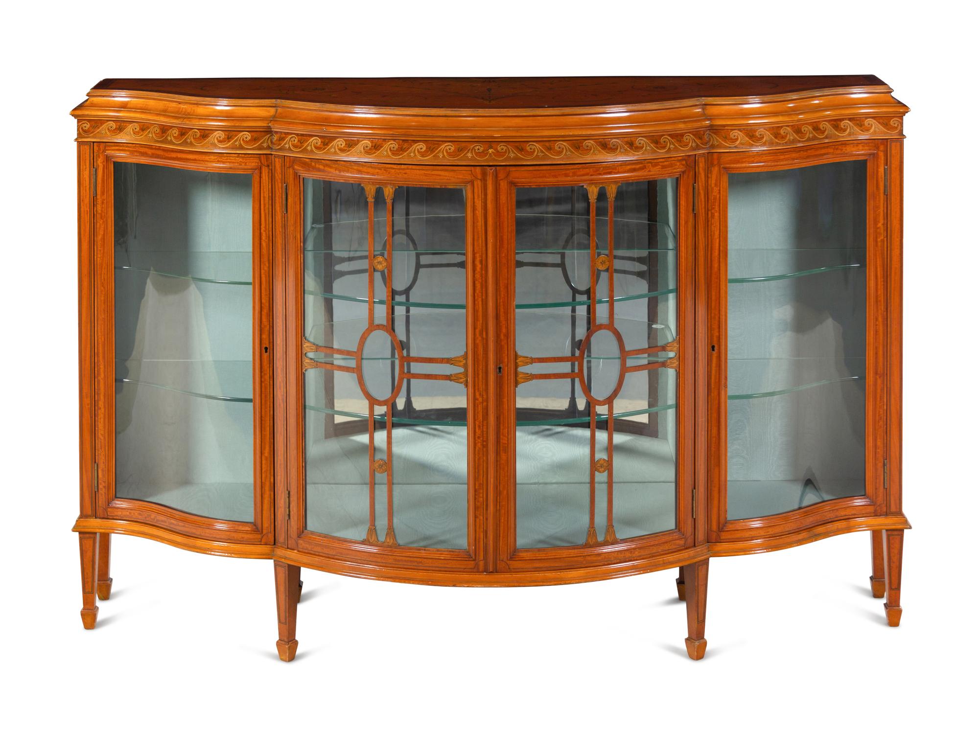 An Edwardian Satinwood and Marquetry Serpentine-Front Cabinet