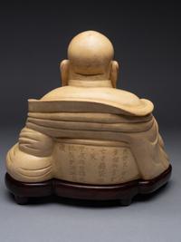 A White Glazed Figure of Budai Buddha
