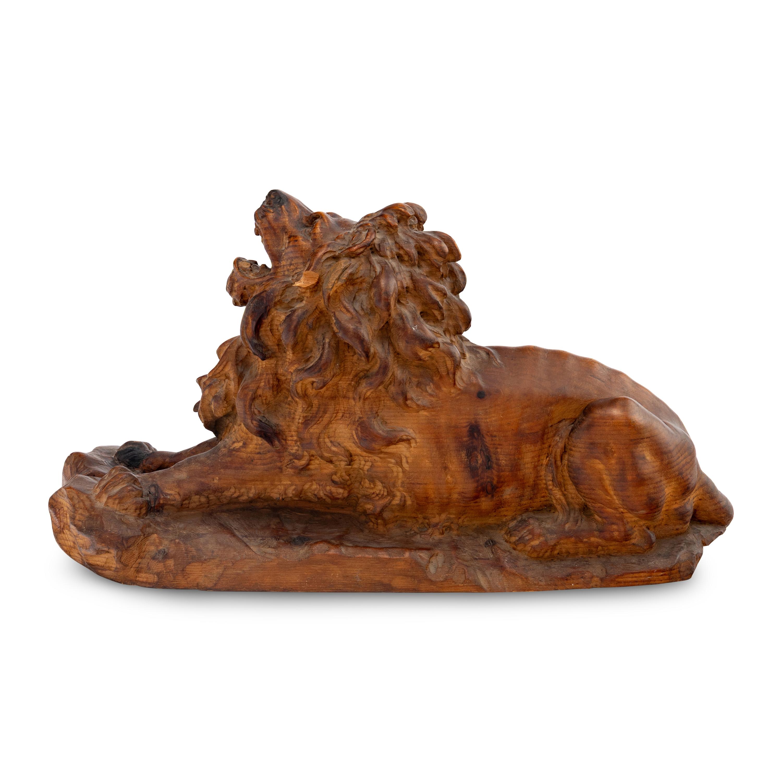 A Carved Oak Model of a Lion