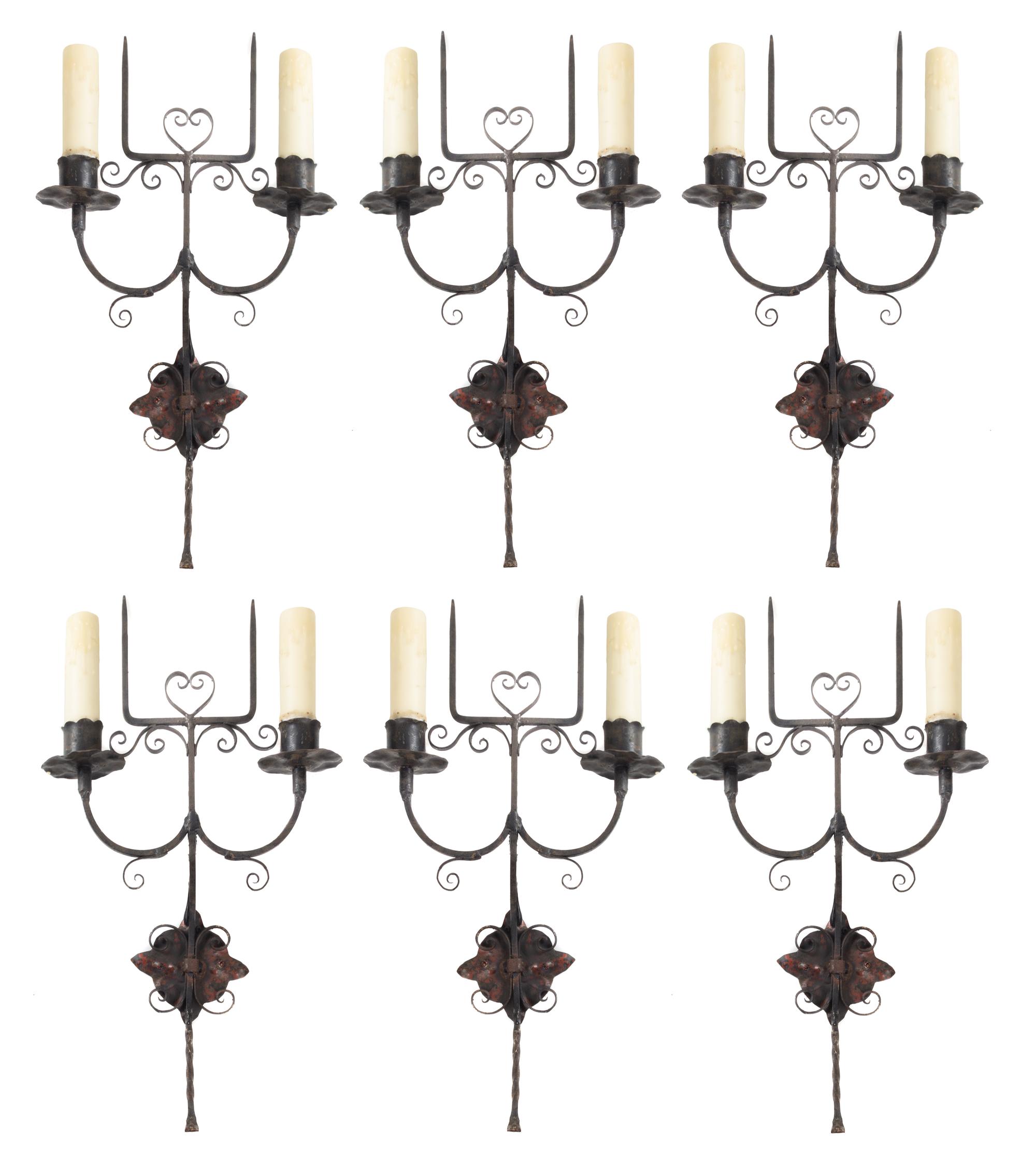 A Set of Six Wrought Metal Two-Light Sconces Height 19 3/4 inches. — STYLE OF ADDISON MIZNER