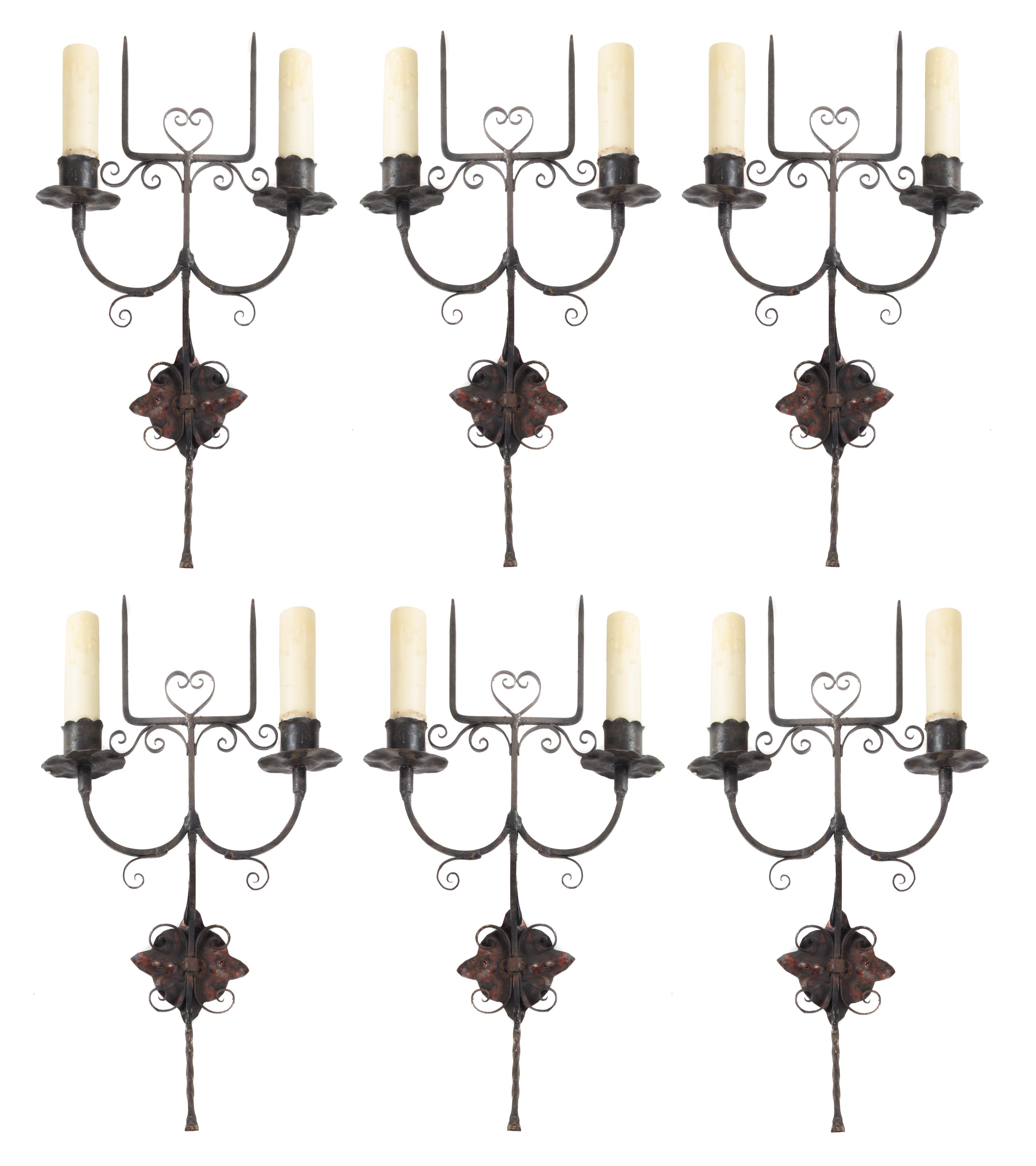 A Set of Six Wrought Metal Two-Light Sconces Height 19 3/4 inches. — STYLE OF ADDISON MIZNER