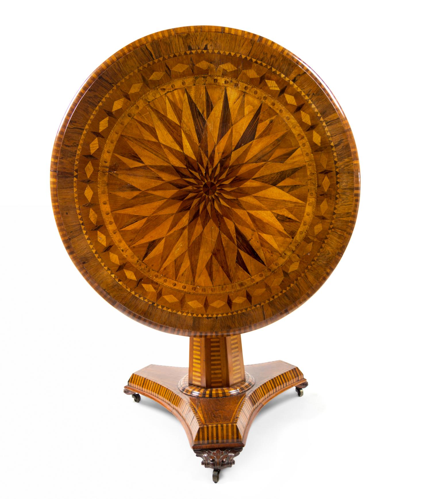 An Early Victorian Rosewood and Specimen Wood Center Table Height 30 1/2 x diameter 39 inches. — MID-19TH CENTURY