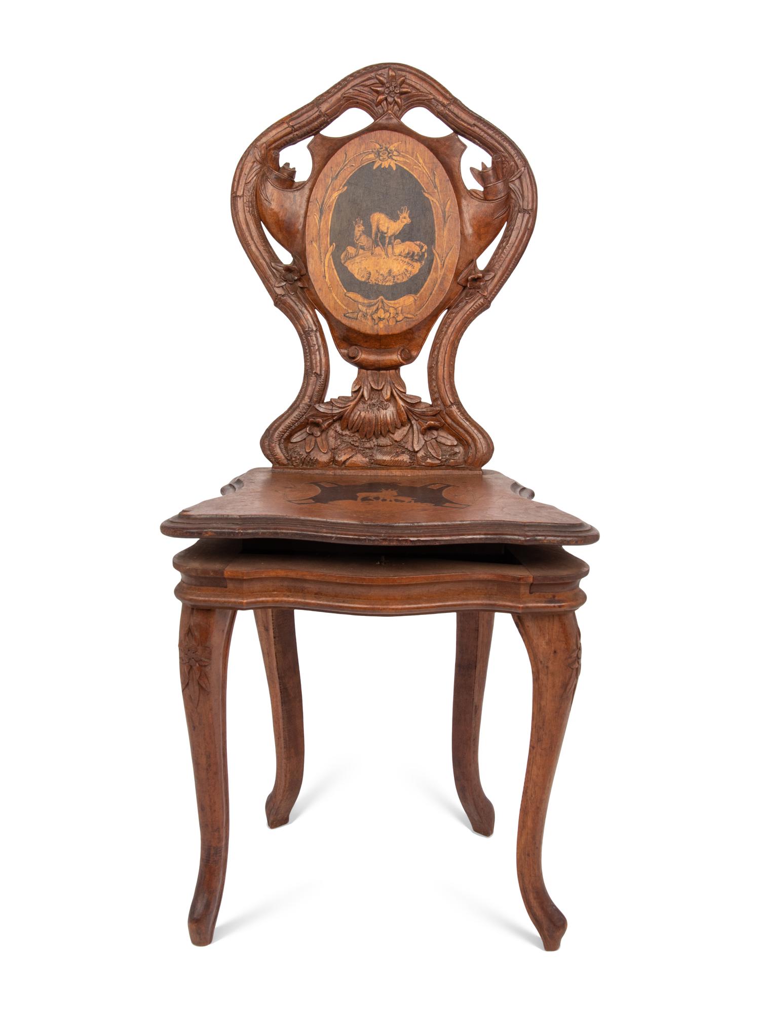 A Carved Black Forest Musical Child's Chair