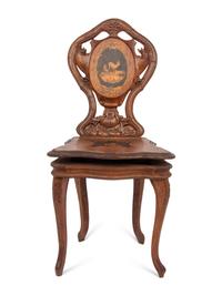 A Carved Black Forest Musical Child's Chair