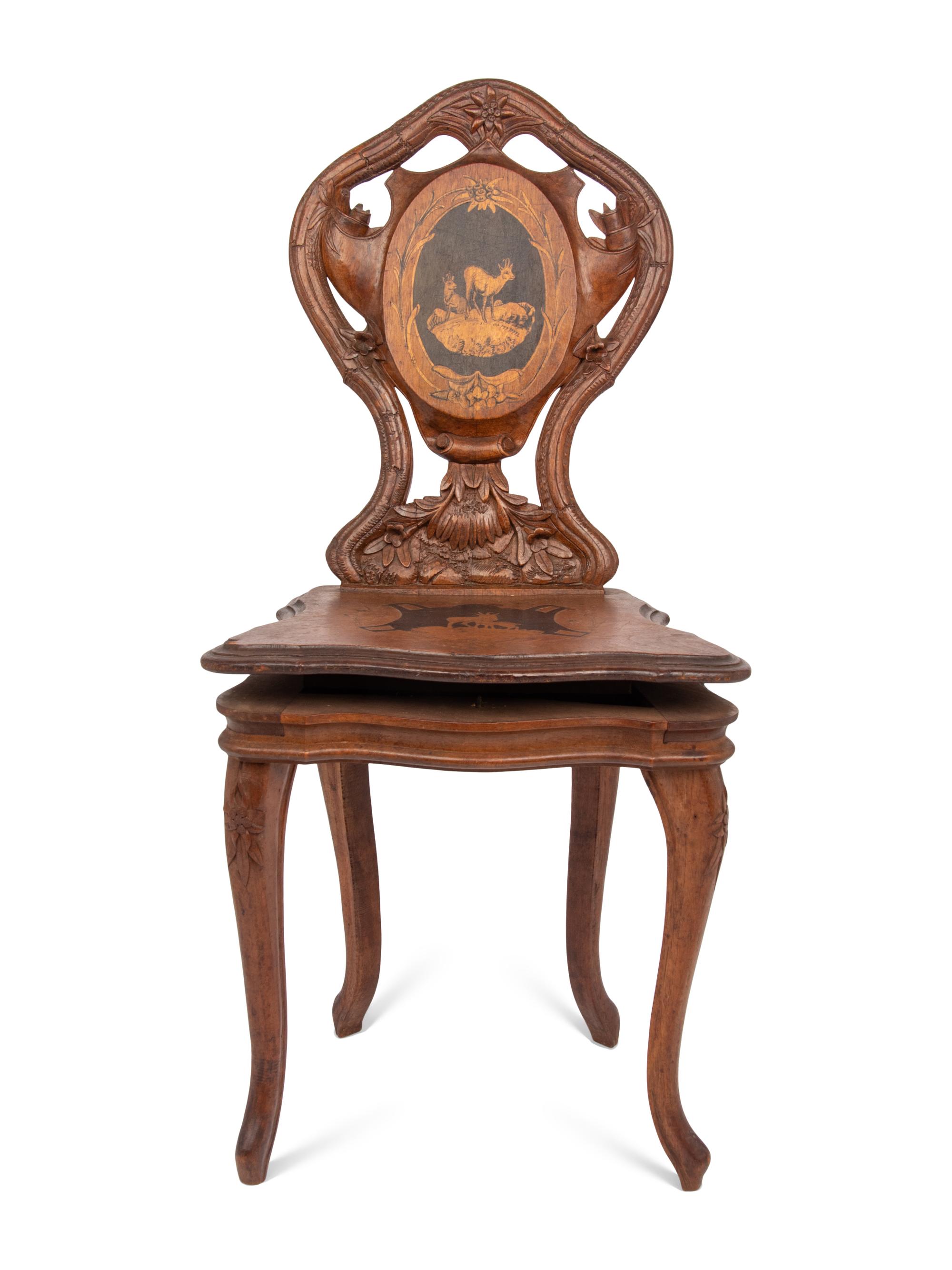 A Carved Black Forest Musical Child's Chair