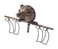 A Black Forest Carved Walnut Bear Form Spoon Rack