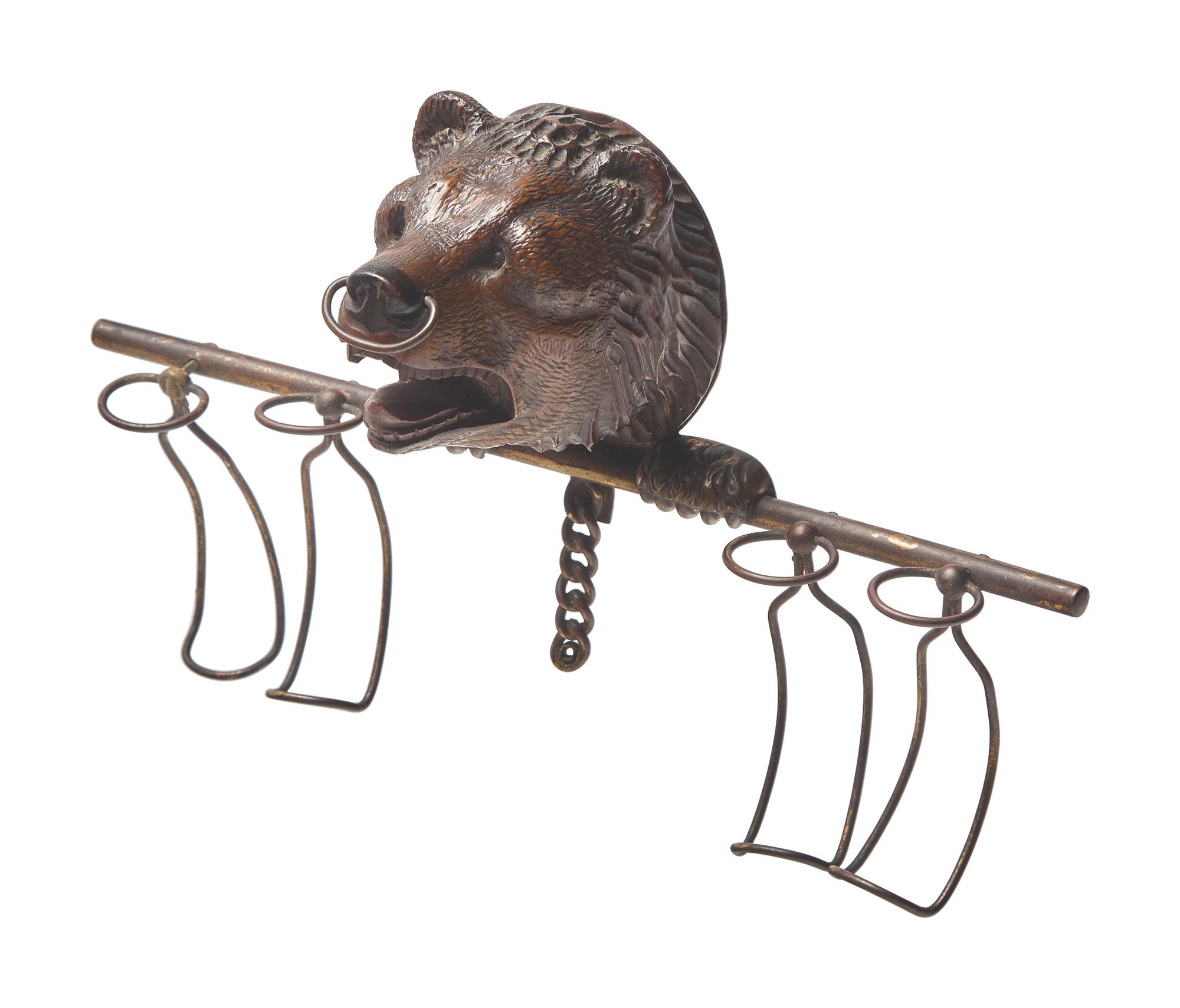 A Black Forest Carved Walnut Bear Form Spoon Rack