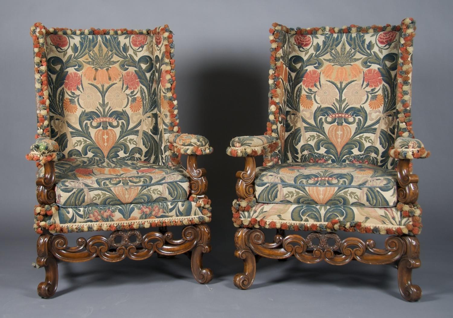 A Pair of Renaissance Revival Wingback Armchairs, Height 46 3/4 inches.