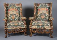 A Pair of Renaissance Revival Wingback Armchairs, Height 46 3/4 inches.