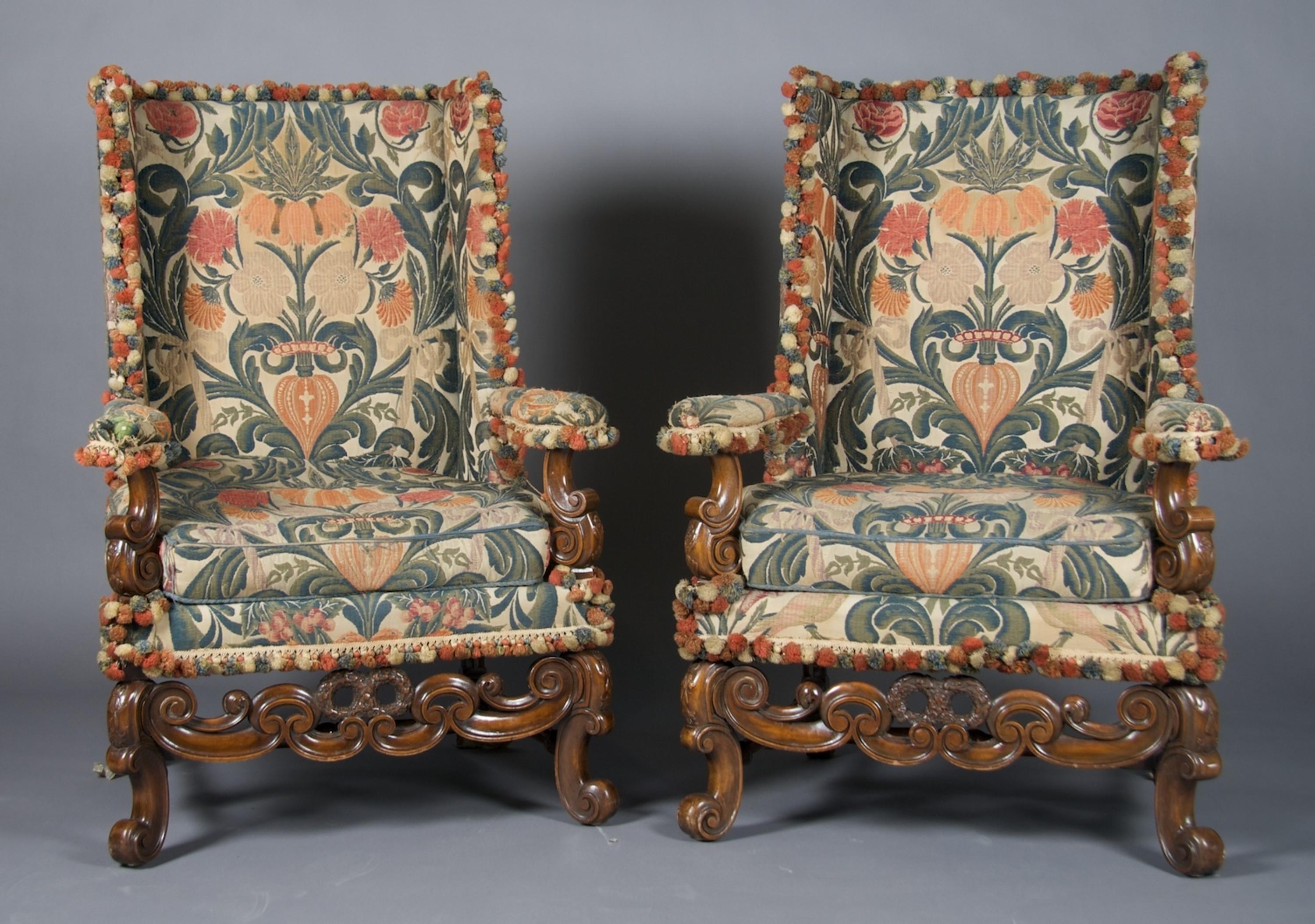 A Pair of Renaissance Revival Wingback Armchairs, Height 46 3/4 inches.
