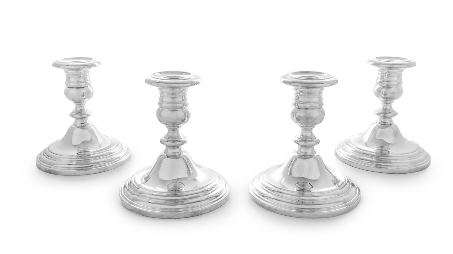 Four American Silver Candlesticks, Gorham Mfg. Co., Providence, RI, having an urn form cup with a knopped stem and a stepped base, weig