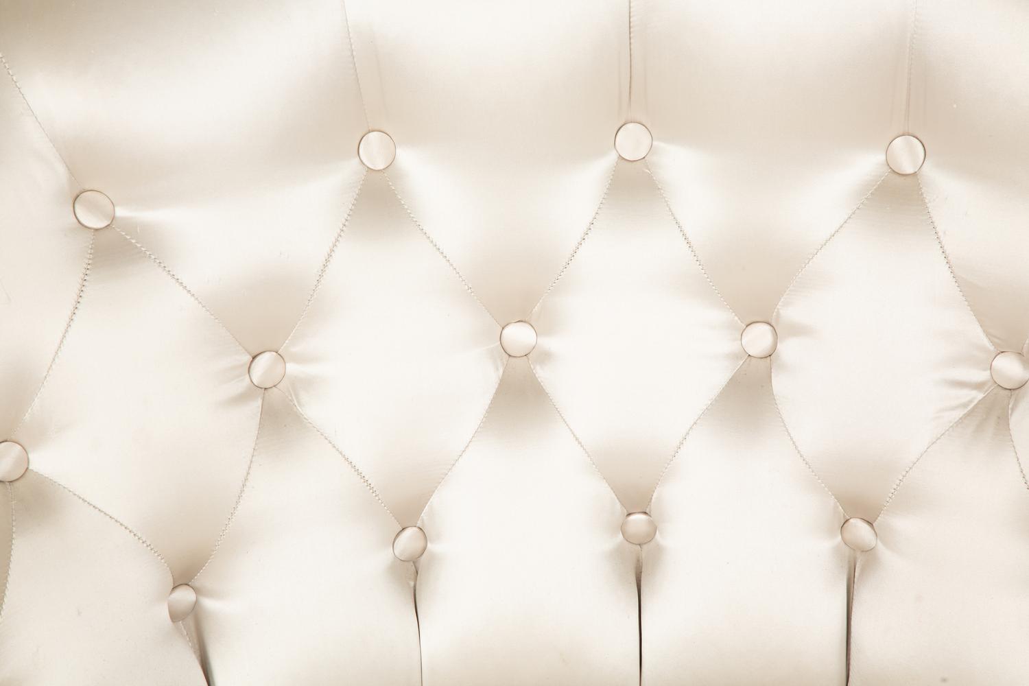 A Button-Tufted Silk-Upholstered Skirted Lounge Chair