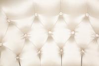 A Button-Tufted Silk-Upholstered Skirted Lounge Chair