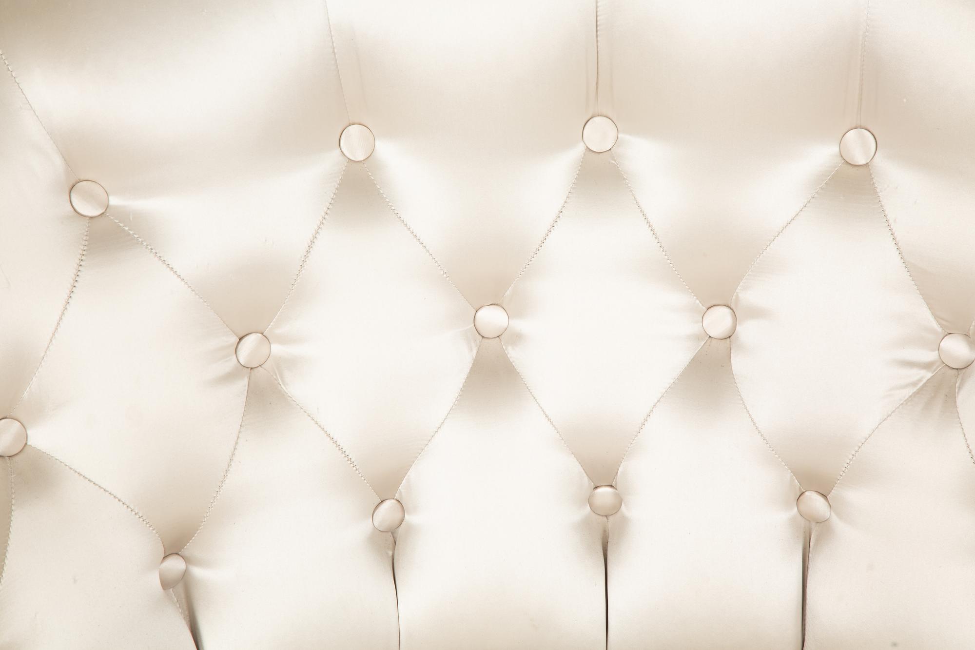 A Button-Tufted Silk-Upholstered Skirted Lounge Chair