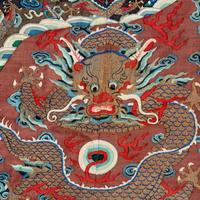 A Chinese Brown Ground Kesi Silk 'Dragon' Robe, Jifu, 19th Century 清晚期 醬地緙絲雲龍紋吉服