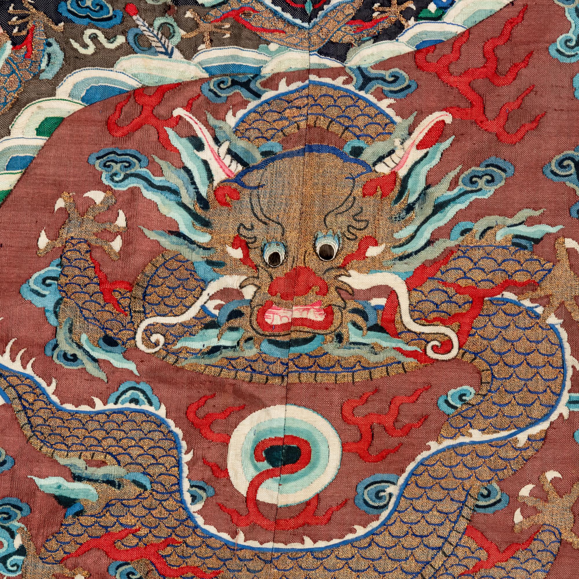 A Chinese Brown Ground Kesi Silk 'Dragon' Robe, Jifu, 19th Century 清晚期 醬地緙絲雲龍紋吉服