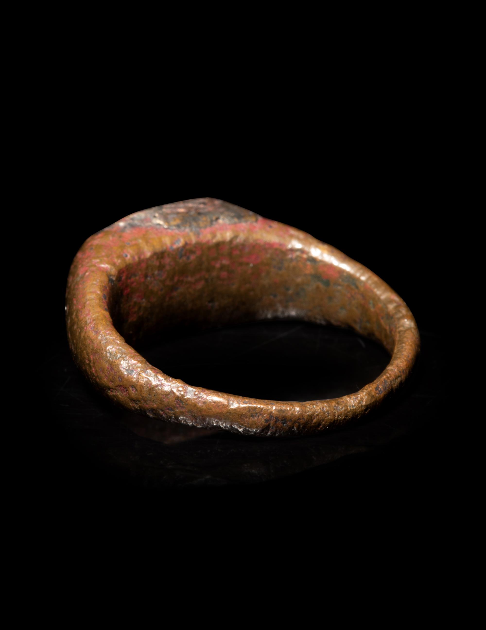 A Roman Bronze and Carnelian Finger Ring