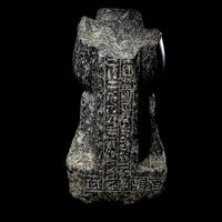 An Egyptian Gneiss Fragment of a Kneeling Figure